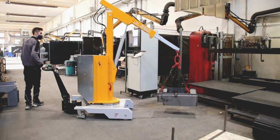 Close-up of Just Lift counterbalanced mini cranes positioned beside heavy machinery