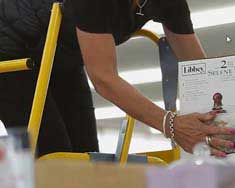 Worker using the Navigator Mobile Warehouse Ladder for safe, efficient order picking and elevated access in a warehouse environment.