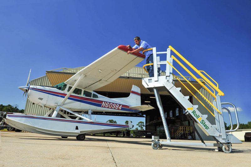 Adjustable Height Work Platform with safety rails and wide steps