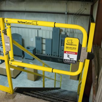 YellowGate Adjustable Safety Swing Gate securing a ladder opening
