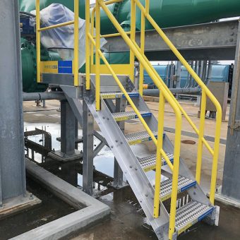 Modular metal stairs with wide treads and handrails