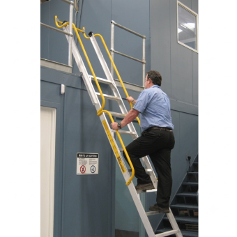 adjustable ladder system with handrails and safety gate providing secure access to elevated warehouse platform
