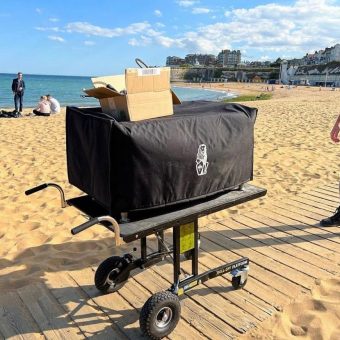 Demtruk transporting large electronic equipment with adjustable platform